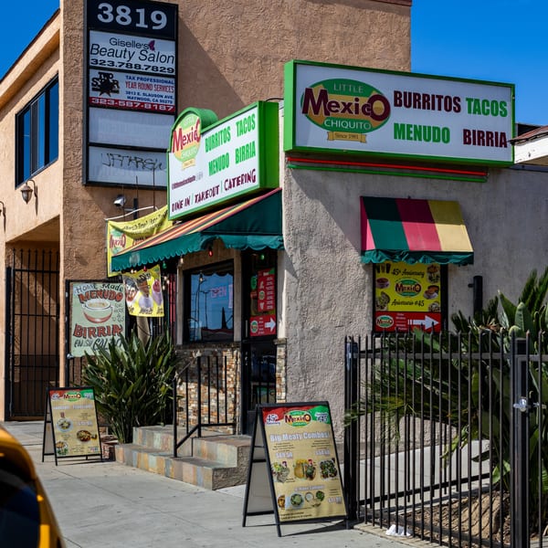 Little Mexico Chiquito restaurant exterior with signs for burritos, tacos, menudo, and birria, and specials.