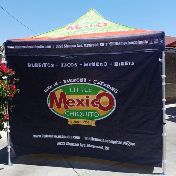 Little Mexico Chiquito branded tent with menu items, address, and social media handles.